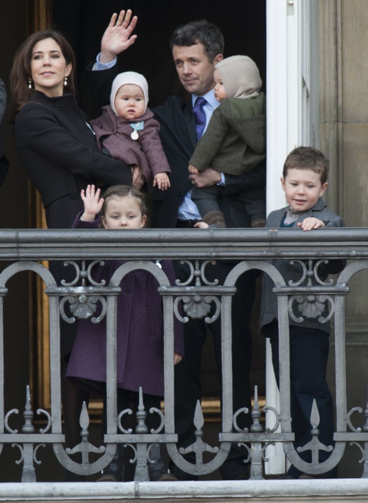Frederik and Mary with baby twins, Josephine and Vincent, and Christian and Isabella, on the balcony
