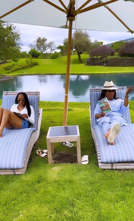 oprah winfrey by pool at home
