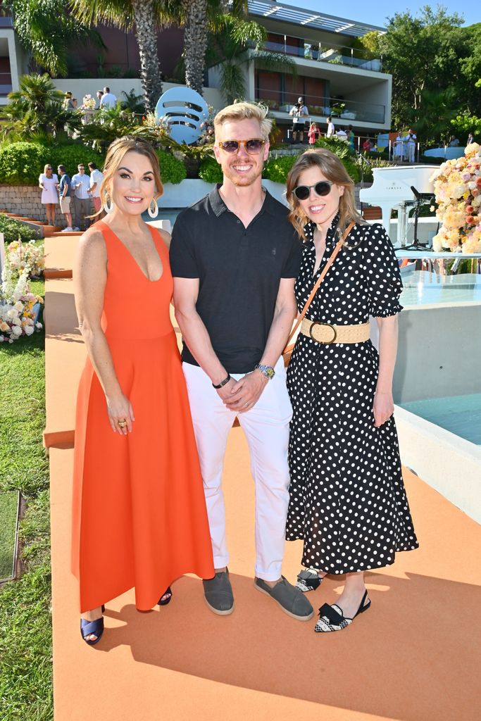 Princess Beatrice in polka dot dress and sunglasses with Dustee Jenkins, Chief Public Affairs Officer at Spotify, Steve Huffman, Co-Founder and CEO of Reddit with 