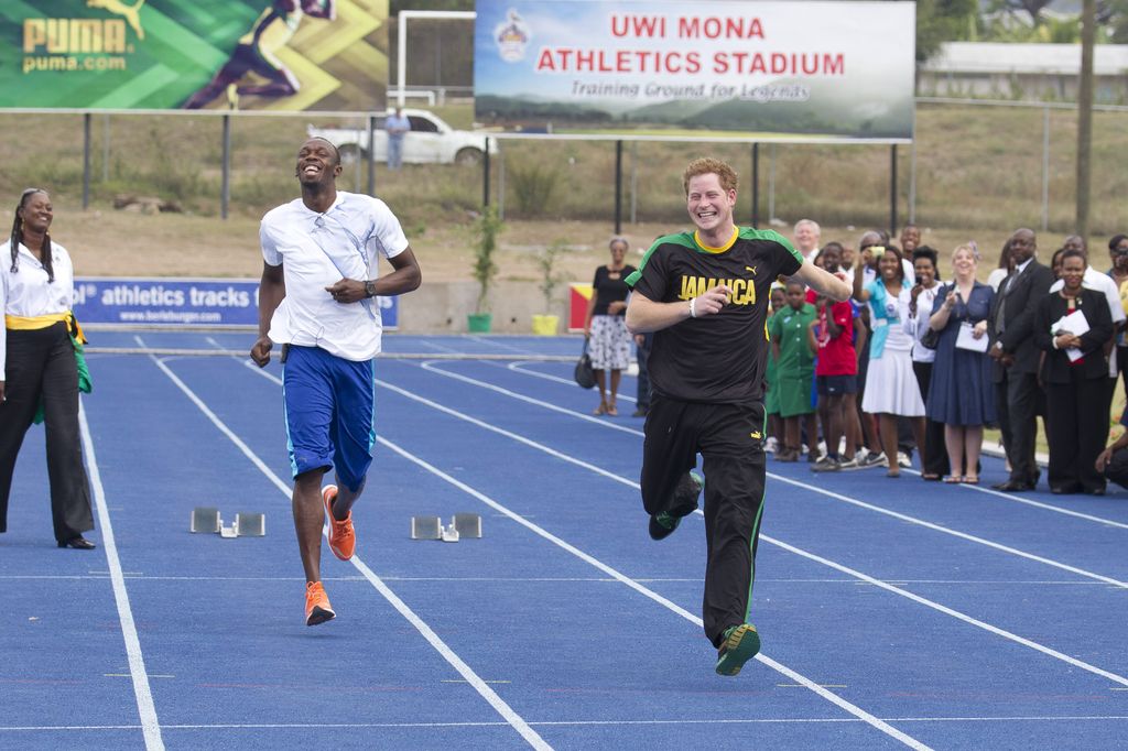 Prince Harry Gets Some Running Tips From Sprinter Usain Bolt, At 'The Usain Bolt Track' At The University Of The West Indies, In Kingston, Jamaica, During His Official Visit To Jamaica. (Photo by Julian Parker/UK Press via Getty Images)