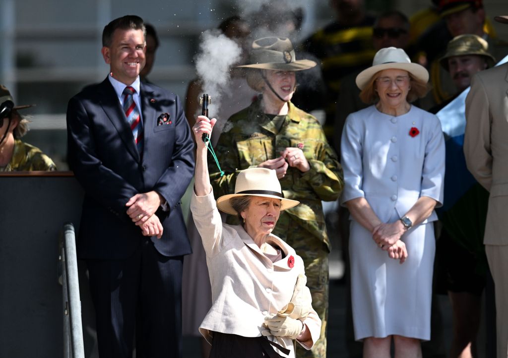 Princess Anne firing a starting pistol in the air