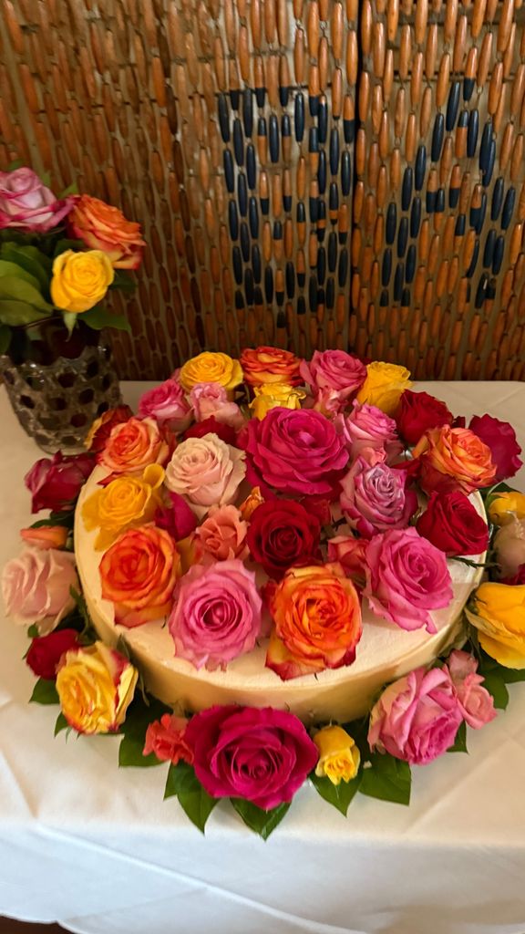 Kourtney Kardashian shared a photo of a rose covered cake from Eve Jobs' wedding