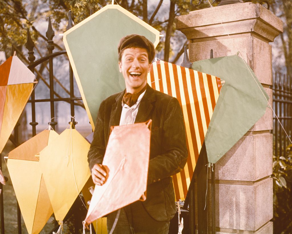 Dick Van Dyke, US actor, poses with a variety of kites in a publicity still for the film, 'Mary Poppins', USA, 1964. The film musical, directed by Robert Stevenson, starred Van Dyke as 'Bert'.