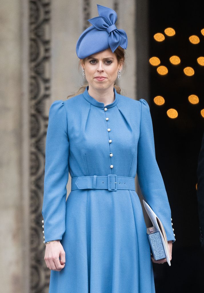 Princess Beatrice wears a blue dress and matching hat