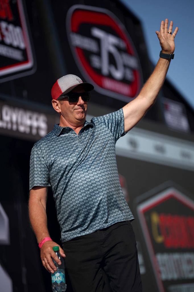 Former NASCAR Cup Series driver, Greg Biffle waves to fans as he walks onstage during pre-race ceremonies prior to the NASCAR Cup Series Cook Out Southern 500 at Darlington Raceway on August 31, 2025 in Darlington, South Carolina.