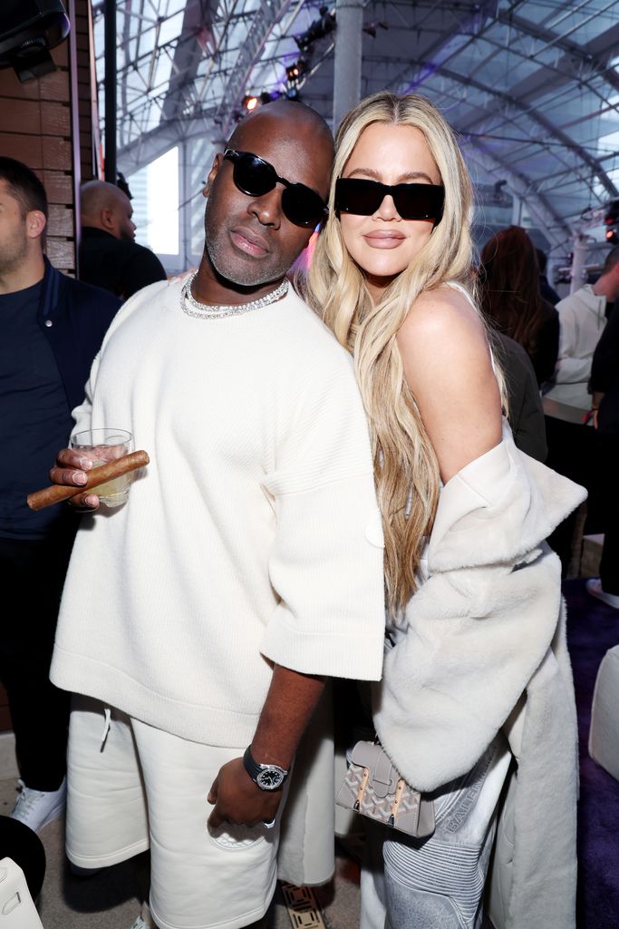 Corey Gamble and Kourtney Kardashian dressed in white