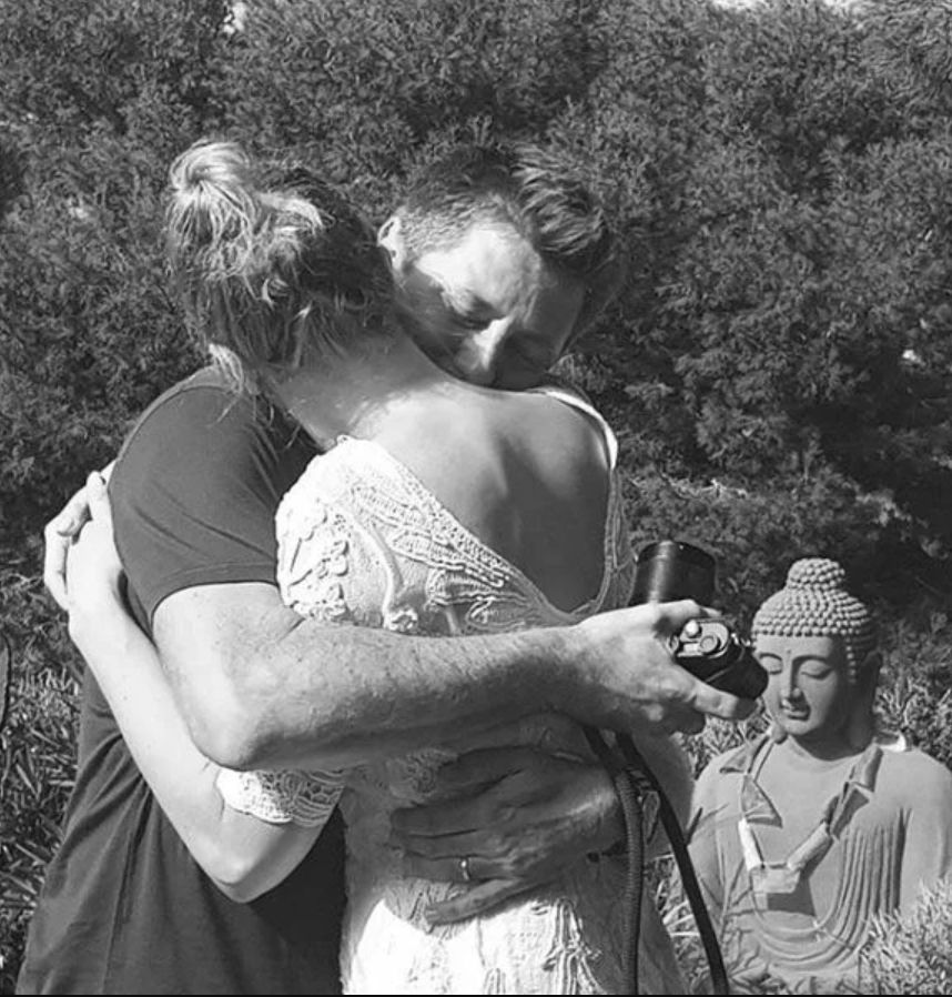 George Clarke hugging wife Katie on their wedding day