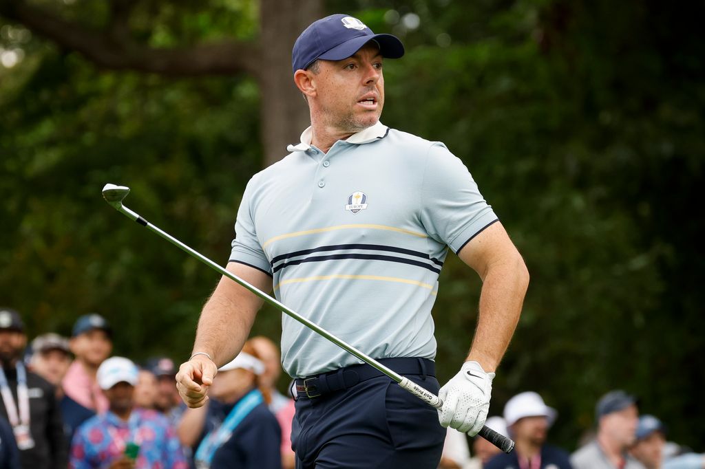 Rory McIlroy in pale blue polo reacts on the third tee during the Friday morning foursomes matches of the 2025 Ryder Cup at Black Course at Bethpage State Park Golf Course 