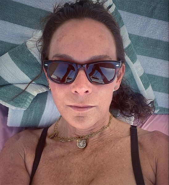 Jennifer Grey in bikini and sunglasses