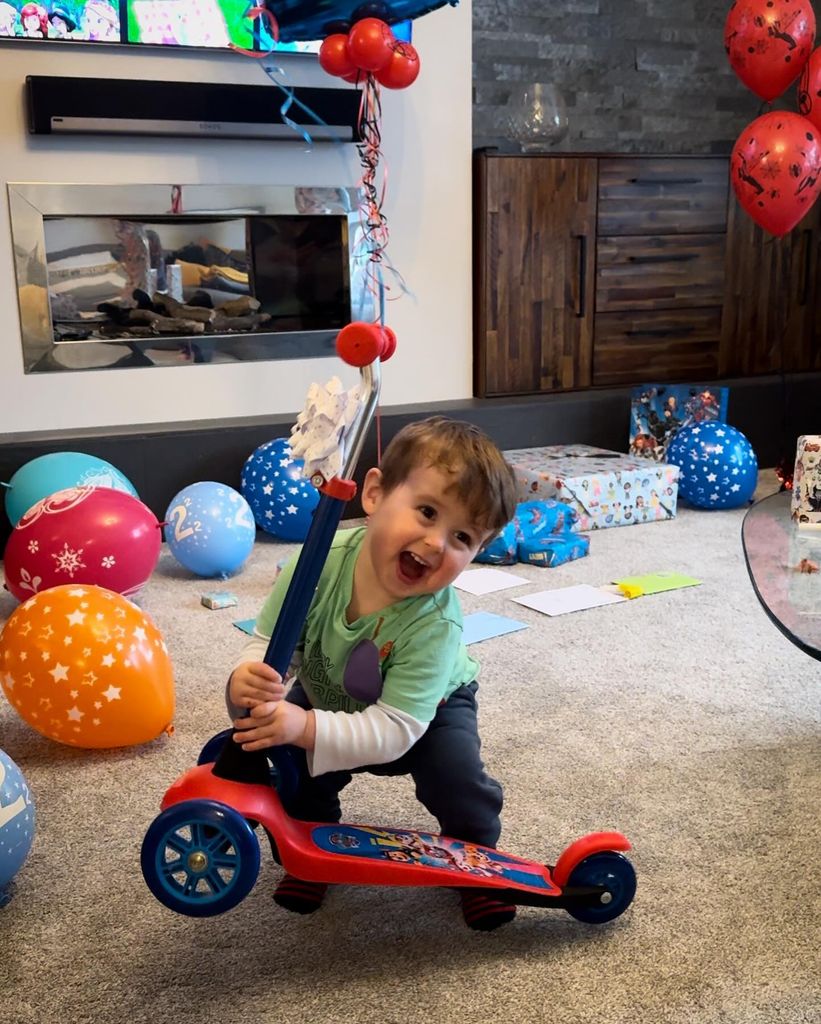 Sam's son with scooter on birthday