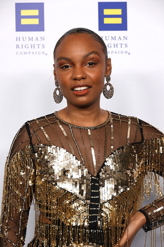 Sierra McClain wearing a gold sequin dress