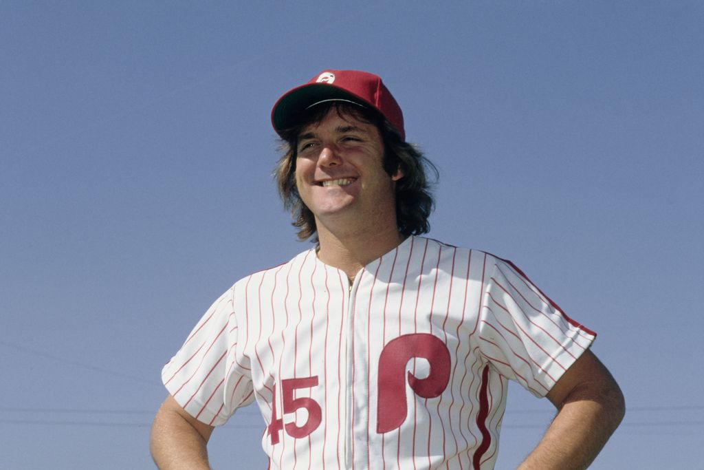 Tug McGraw in baseball jersey and red cap