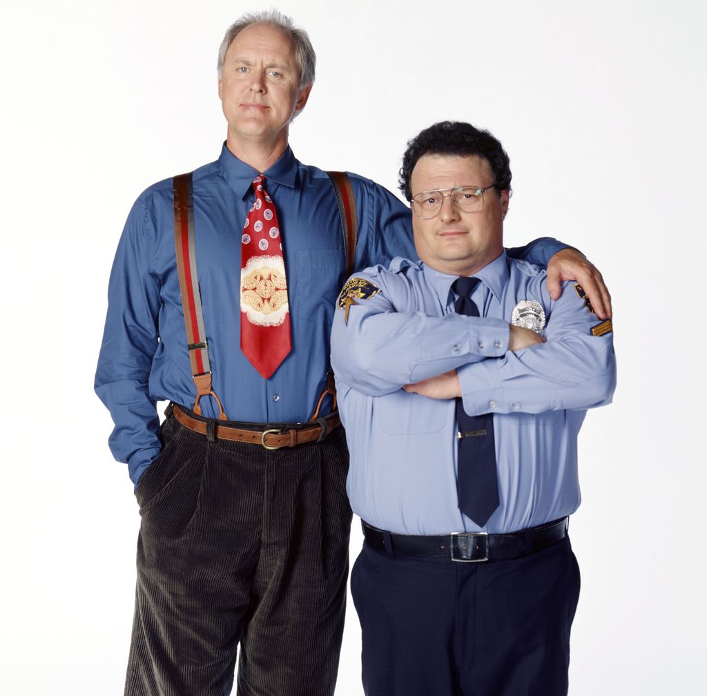 Pictured: (l-r) John Lithgow as Dr. Dick Solomon, Wayne Knight as Officer Don Orville in 3rd Rock from the Sun
