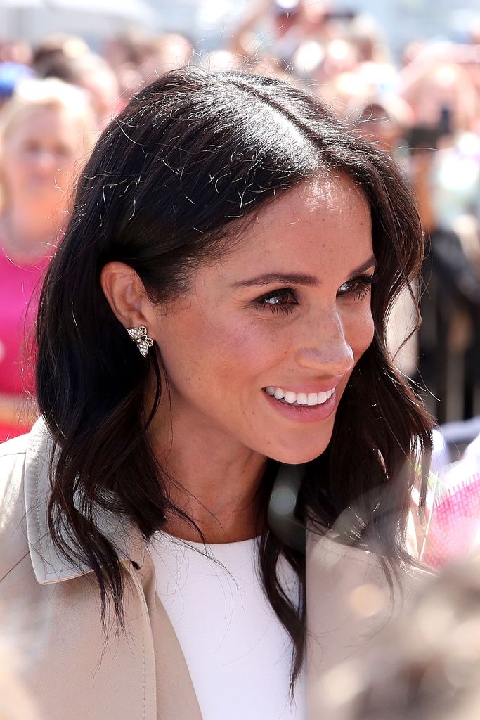 Meghan Markle wearing Princess Diana's diamond and sapphire butterfly studs during a tour of Australia in 2018