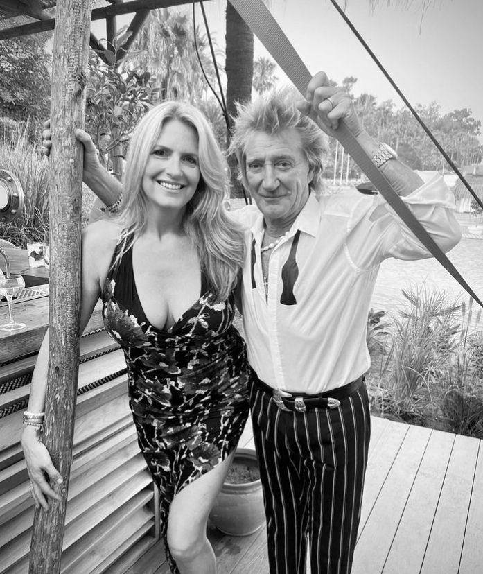 Black and white photo of Penny Lancaster standing with Rod Stewart