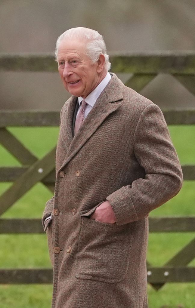 man in coat walking outdoors