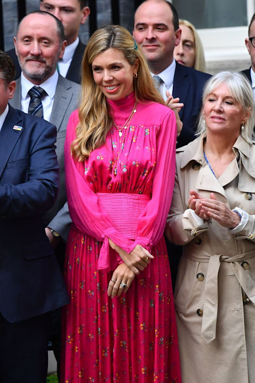 Carrie Johnson in a pink dress