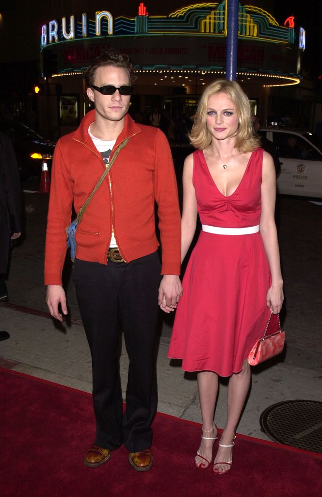 photo of heath ledger and heather graham holding hands
