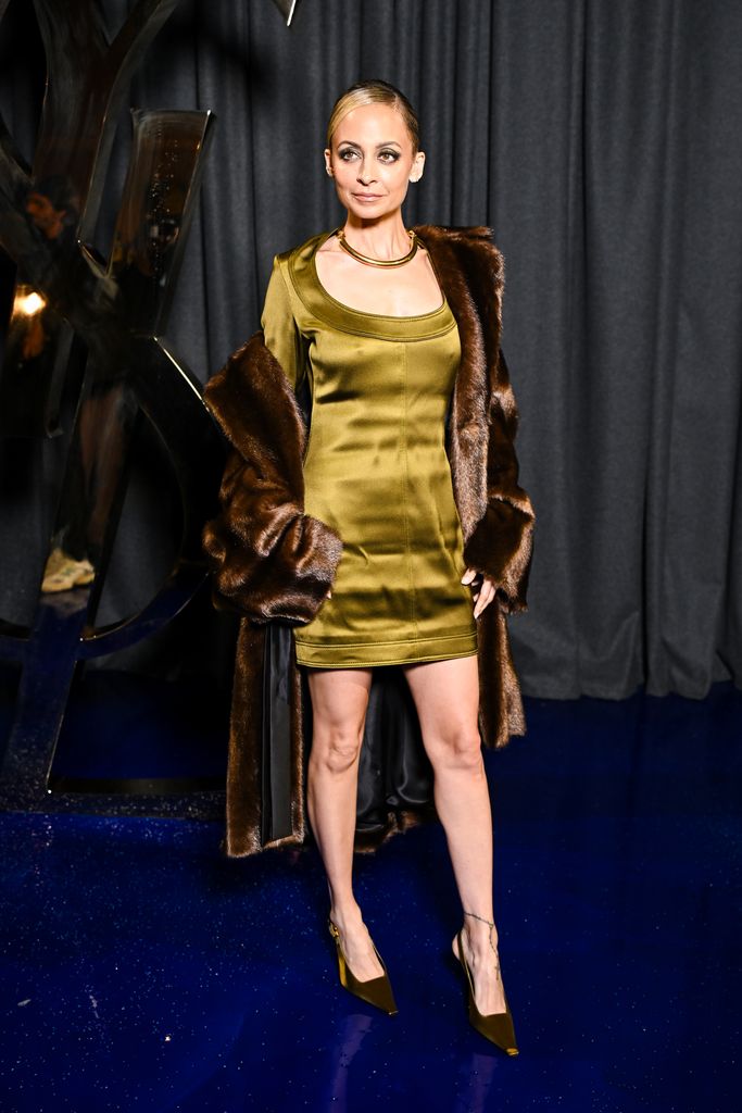 Nicole Ritchie in olive green dress and fur coat