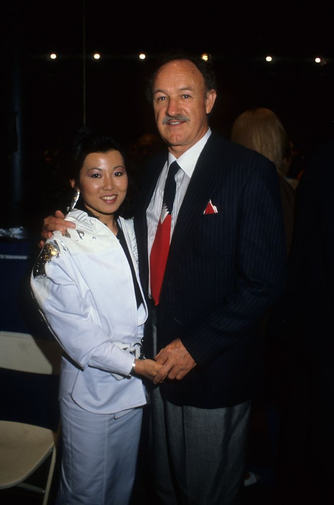 gene hackman and wife betsy holding hands posing for photo