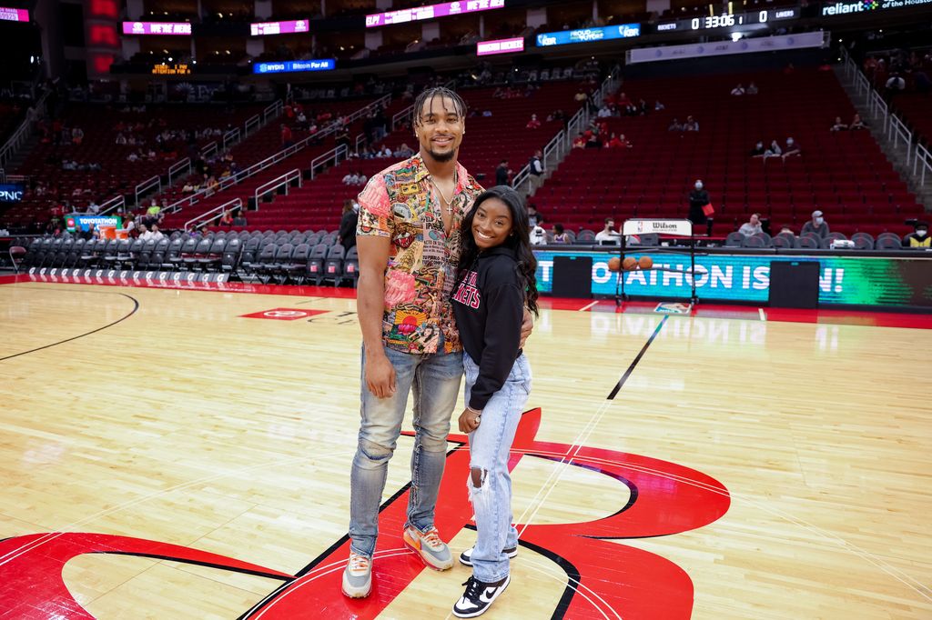 Simone Biles and Jonathan Owens attend a game between the Houston Rockets and the Los Angeles Lakers at Toyota Center on December 28, 2021 in Houston, Texas
