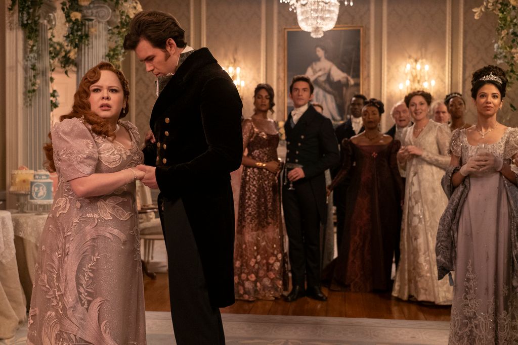 Nicola Coughlan as Penelope Featherington, Simone Ashley as Kate Sharma, Jonathan Bailey as Anthony Bridgerton, Victor Alli as John Stirling, Adjoa Andoh as Lady Agatha Danbury, Ruth Gemmell as Lady Violet Bridgerton in episode Bridgerton 