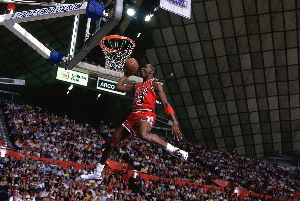 Michael Jordan of the Chicago Bulls (23) in action, making dunk during All Star Weekend, Seattle, WA 2/8/1987