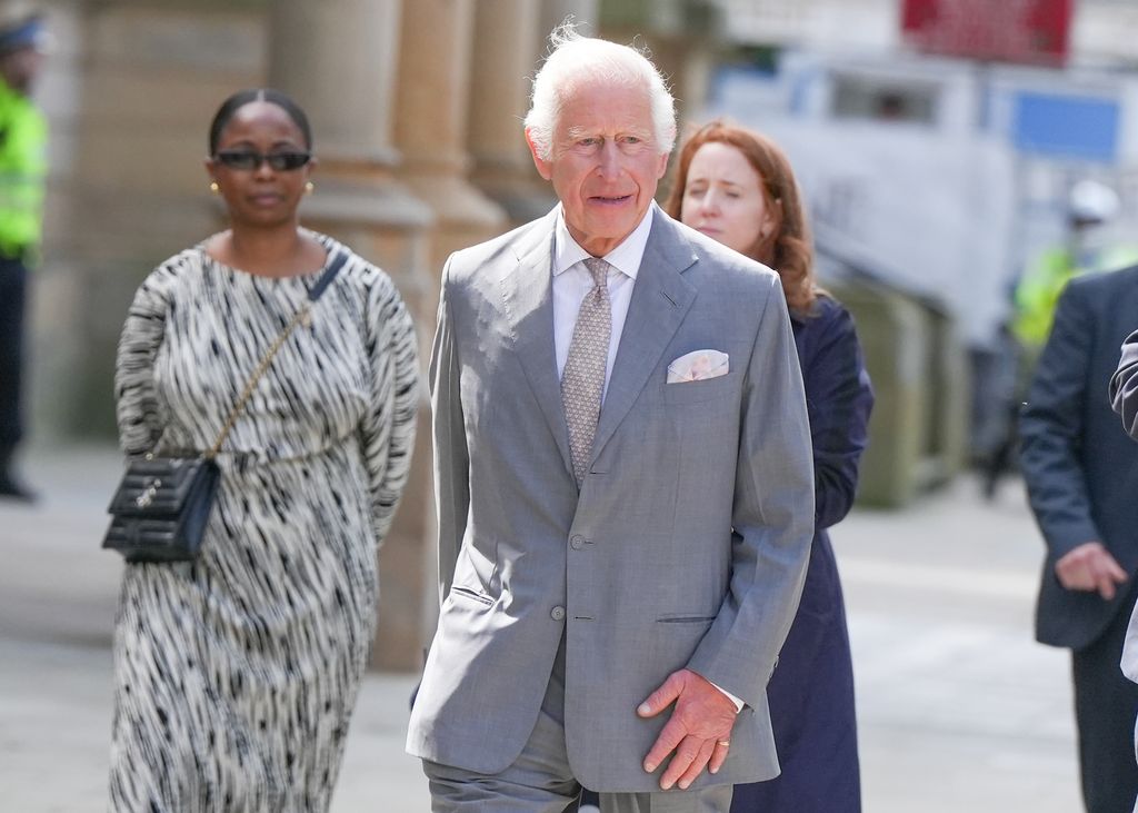 King Charles in grey suit