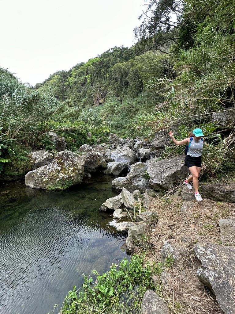 Woman jumping and hiking in The Azores