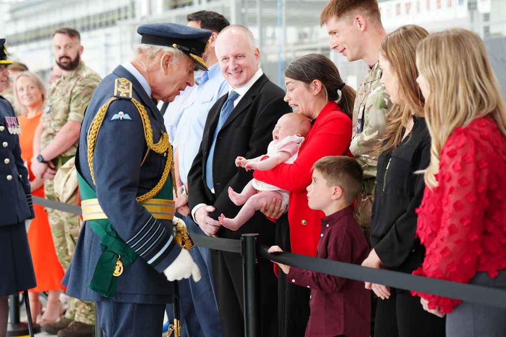 King Charles reacts to a baby