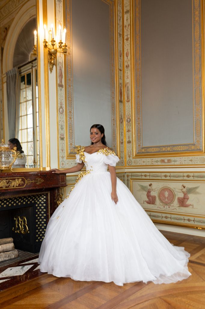 Bronwyn Vance posed in grand room in white gown