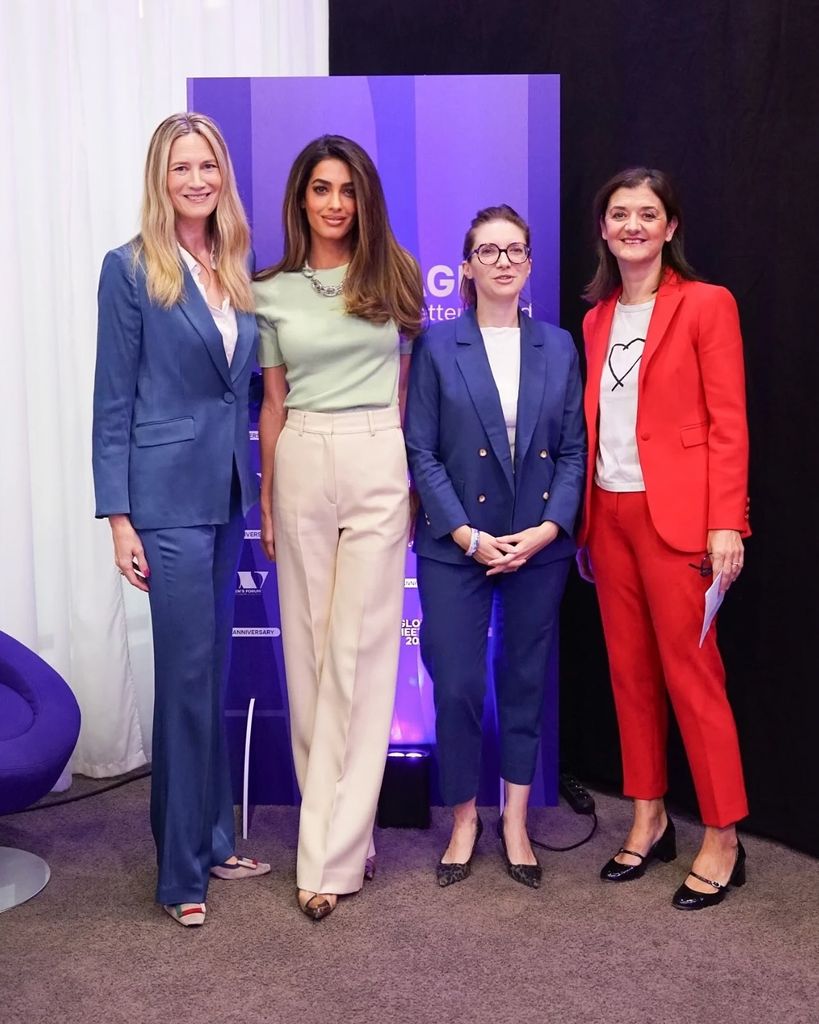 Amal  in a cream and mint green ensemble in line of women