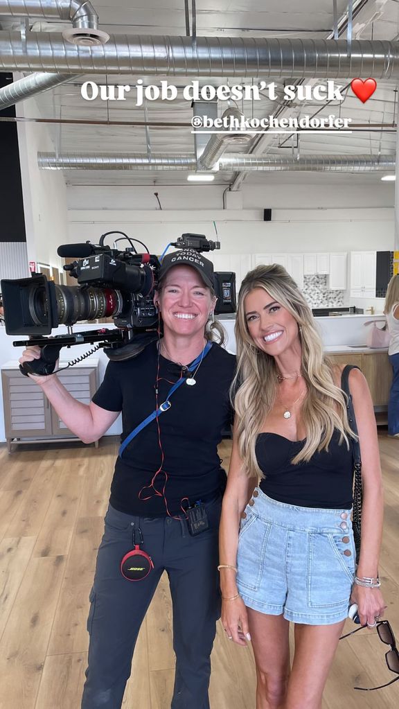 Christina Hall (right) poses with her HGTV director 