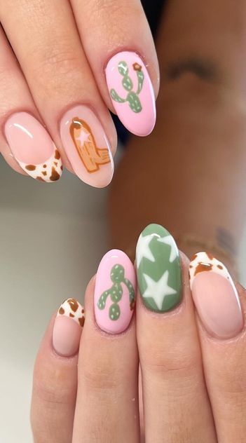 pink and green western nails with cactus cow print stars and boots