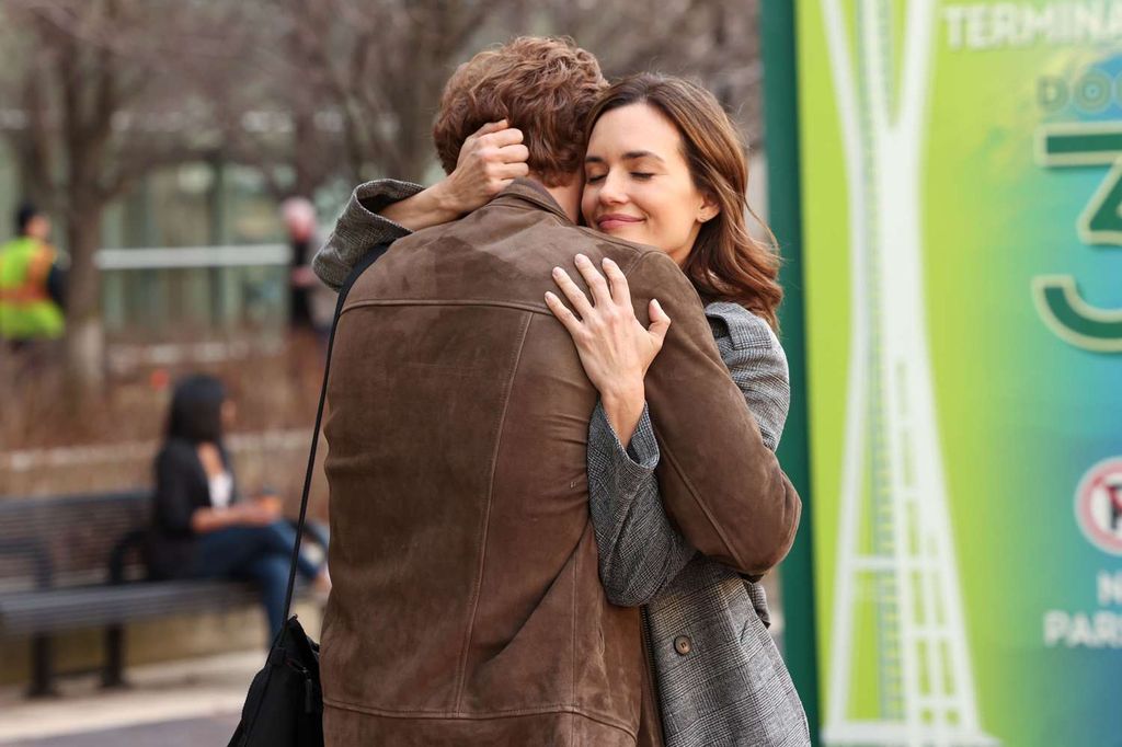 Nick Gehlfuss and Torrey DeVitto hug as Dr. Will Halstead and Dr Natalie Manning in Chicago Med