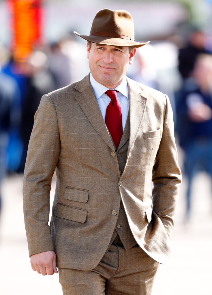 man in tweed suit and brown hat 