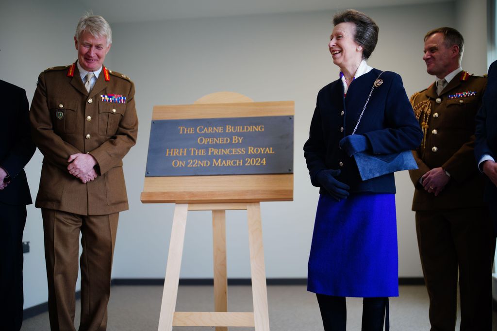 The Princess Royal unveiling a plaque in blue outfit