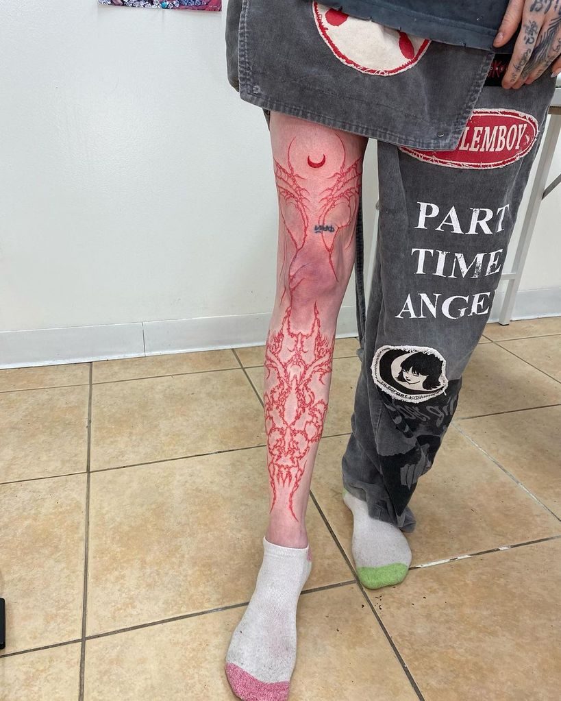 Grimes' leg tattoo looking sore