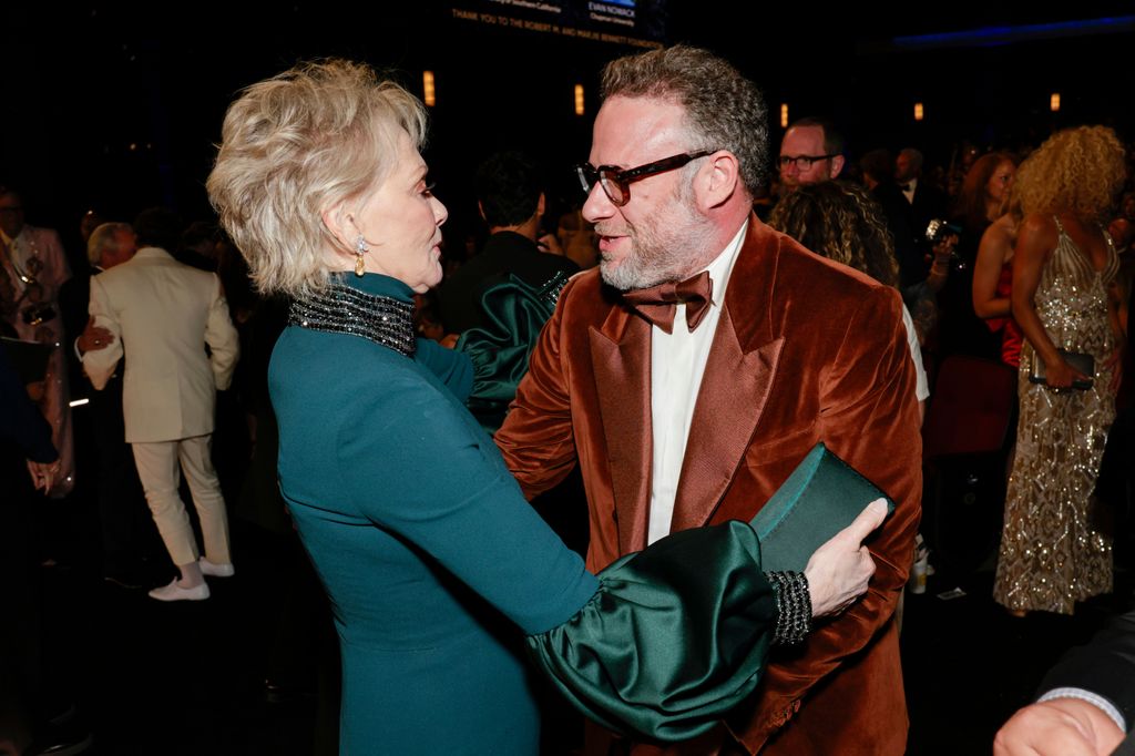 woman and man greeting each other in dimly lit room