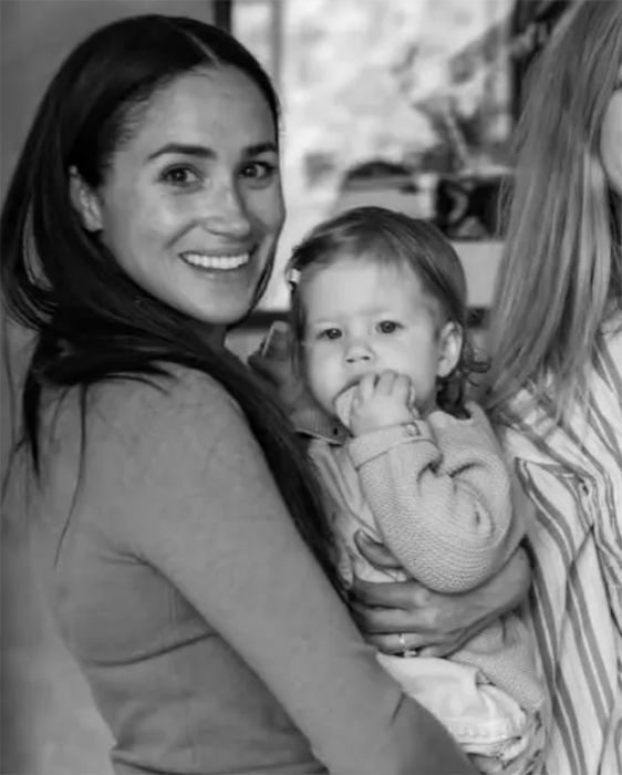 Meghan Markle holds her daughter Lilibet