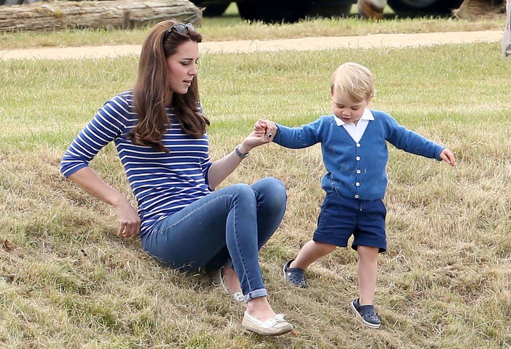 Kate Middleton and Prince George hold hands at the polo