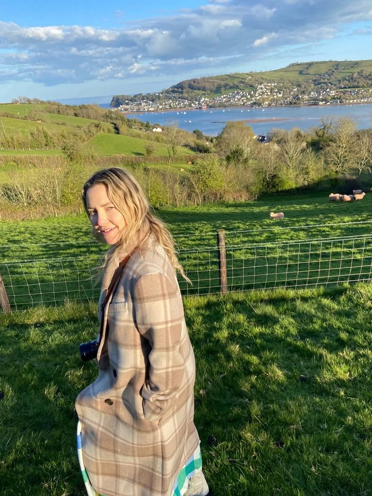 Kate Hudson in check cardigan in countryside