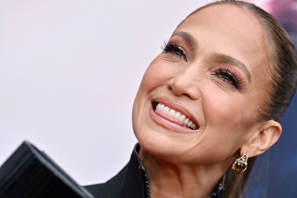 Jlo smiling at a premiere