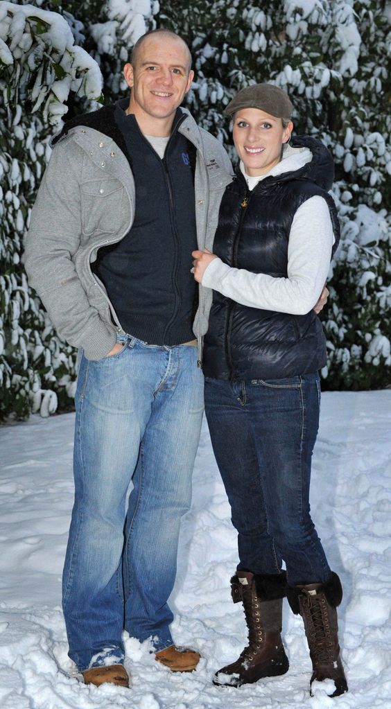 Zara Phillips, daughter of Princess Anne, and grand-daughter of Britain's Queen Elizabeth II, shows the photographer her engagement ring as she poses for a photograph with her fiance, England rugby player Mike Tindall (not pictured), after the announcement of their engagement, at their home in Gloucestershire, south west England on December 21, 2010.  Queen Elizabeth II's eldest grand-daughter Zara Phillips is to wed her rugby-playing boyfriend Mike Tindall, Buckingham Palace announced Tuesday, in a marriage of world-beating sports stars.  Setting up the prospect of two royal weddings in 2011, the announcement comes a month after her cousin Prince William, the second in line to the throne, revealed his engagement to university sweetheart Kate Middleton.                AFP PHOTO / Tim Ireland / Pool (Photo credit should read Tim Ireland/AFP via Getty Images)