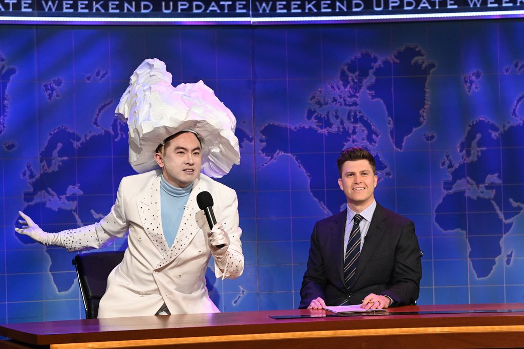 Bowen Yang as 'The Iceberg That Sank The Titanic' and anchor Colin Jost during Weekend Update on Saturday, April 10, 2021 