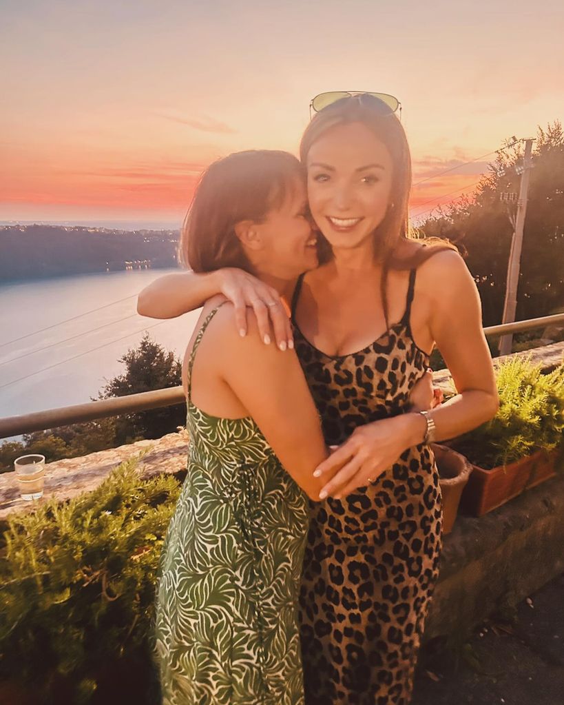 two women hugging on holiday