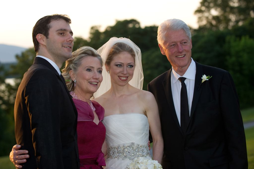 Marc Mezvinsky, U.S. Secretary of State Hillary Clinton, Chelsea Clinton and former U.S. President Bill Clinton pose during the wedding of Chelsea Clinton and Marc Mezvinsky at the Astor Courts Estate on July 31, 2010 in Rhinebeck, New York