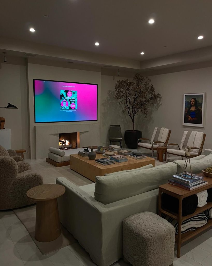 Cream and brown living room with big sofas and TV