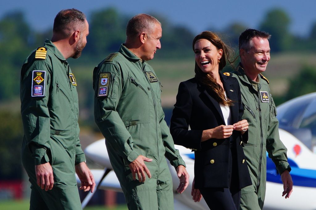 Kate Middleton laughs with pilots at air base