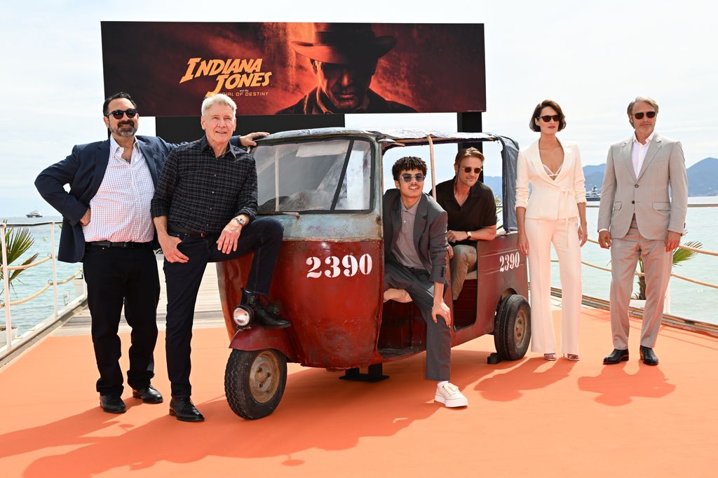 Director James Mangold, Harrison Ford, Ethann Isidore, Boyd Holbrook, Phoebe Waller-Bridge, and Mads Mikkelsen attended the photocall for Indiana Jones and the Dial of Destiny during the 76th Cannes Film Festival